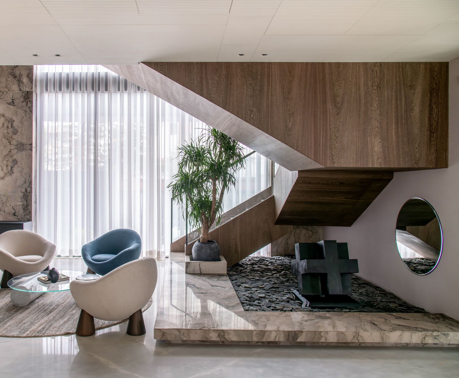 Chic interior showcasing a modern staircase, elegant seating, and decorative elements. — How to Choose the Right Roofing Cont