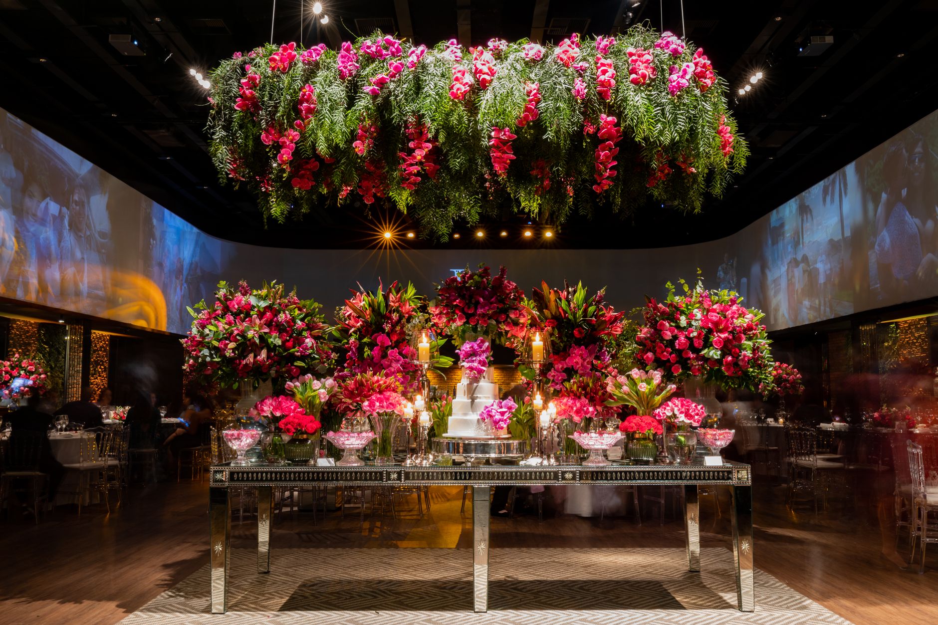 Stunning flower arrangements and cake table set in an elegant indoor venue. — The Dangers of Condensation: Protecting Windows