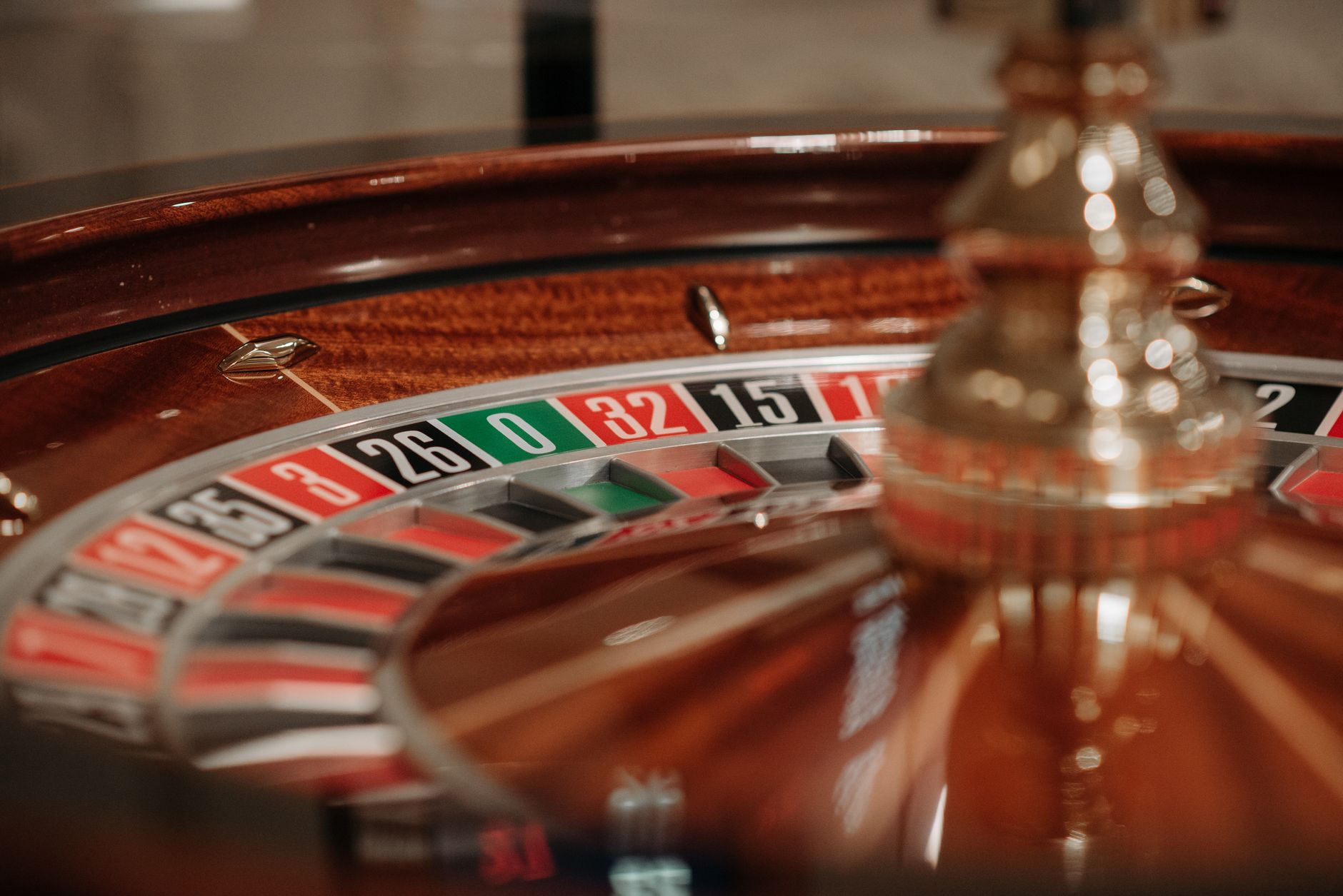 Detailed view of a spinning roulette wheel in a casino setting, showcasing numbers and colors. — The Evolution of Casino Gami