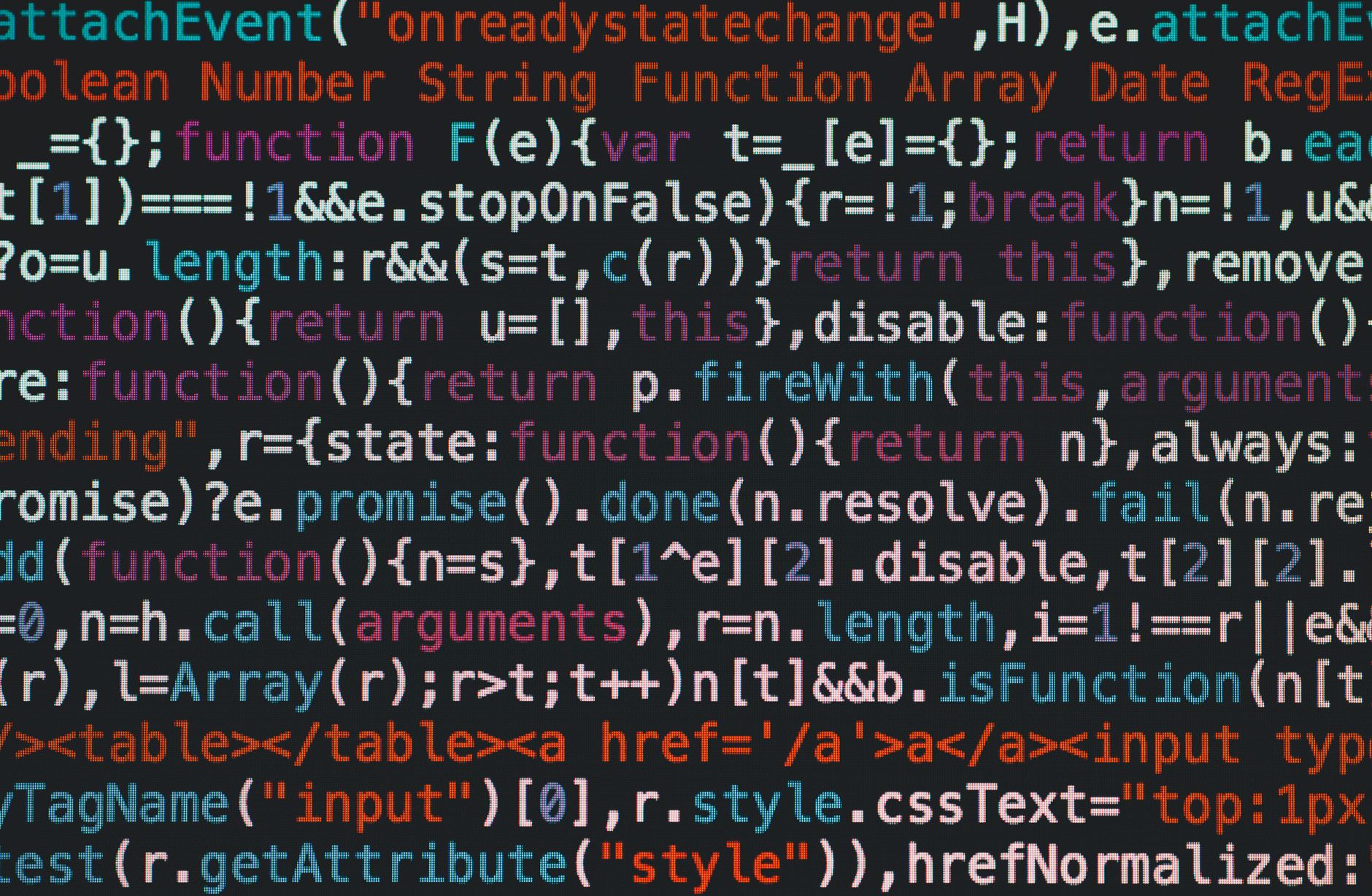 Close-up of colorful coding text on a dark computer screen, representing software development. — The Future of Live Casino Ga