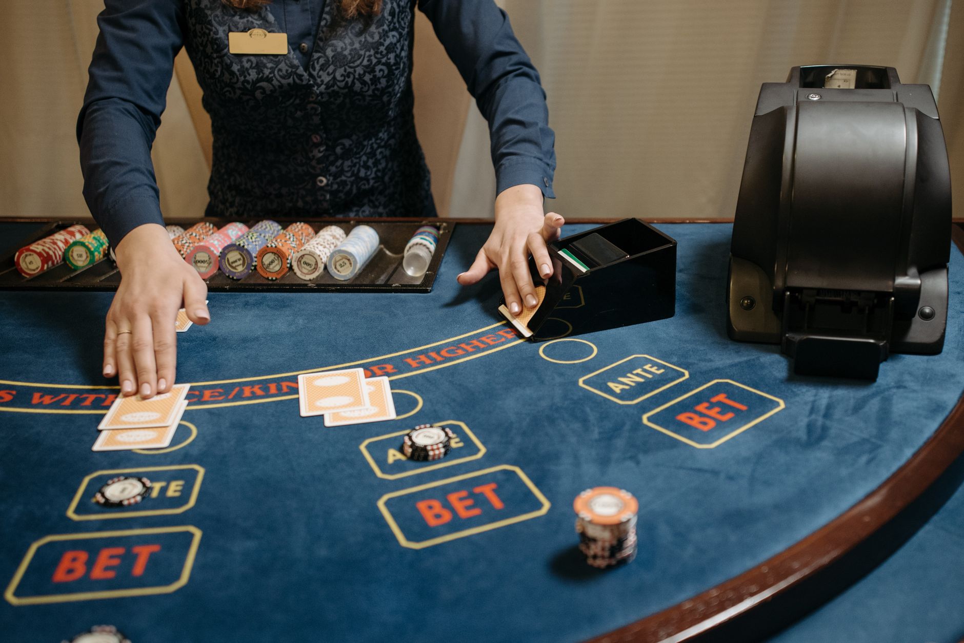 Casino dealer organizing cards and chips on a gaming table during a game. — The Impact of Artificial Intelligence on Casino O