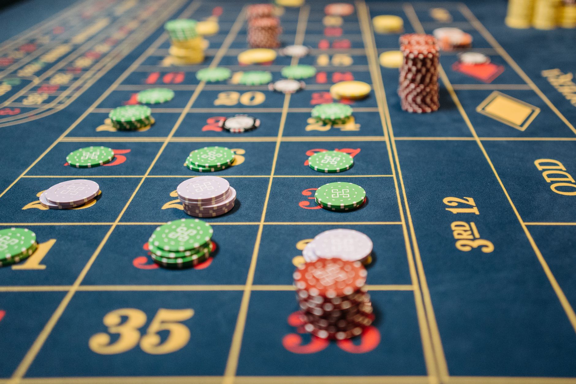 Close-up of a roulette table with colorful poker chips, capturing the thrill of casino gambling. — The Rise of Live Casino Ga