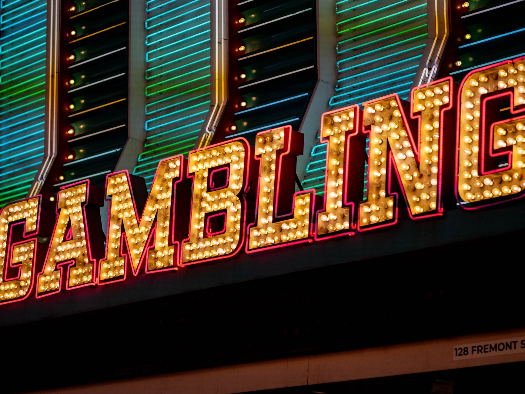 Bright neon sign displaying 'Gambling' with vibrant lights at night in Las Vegas. — The Rise of Live Dealer Games in Online C