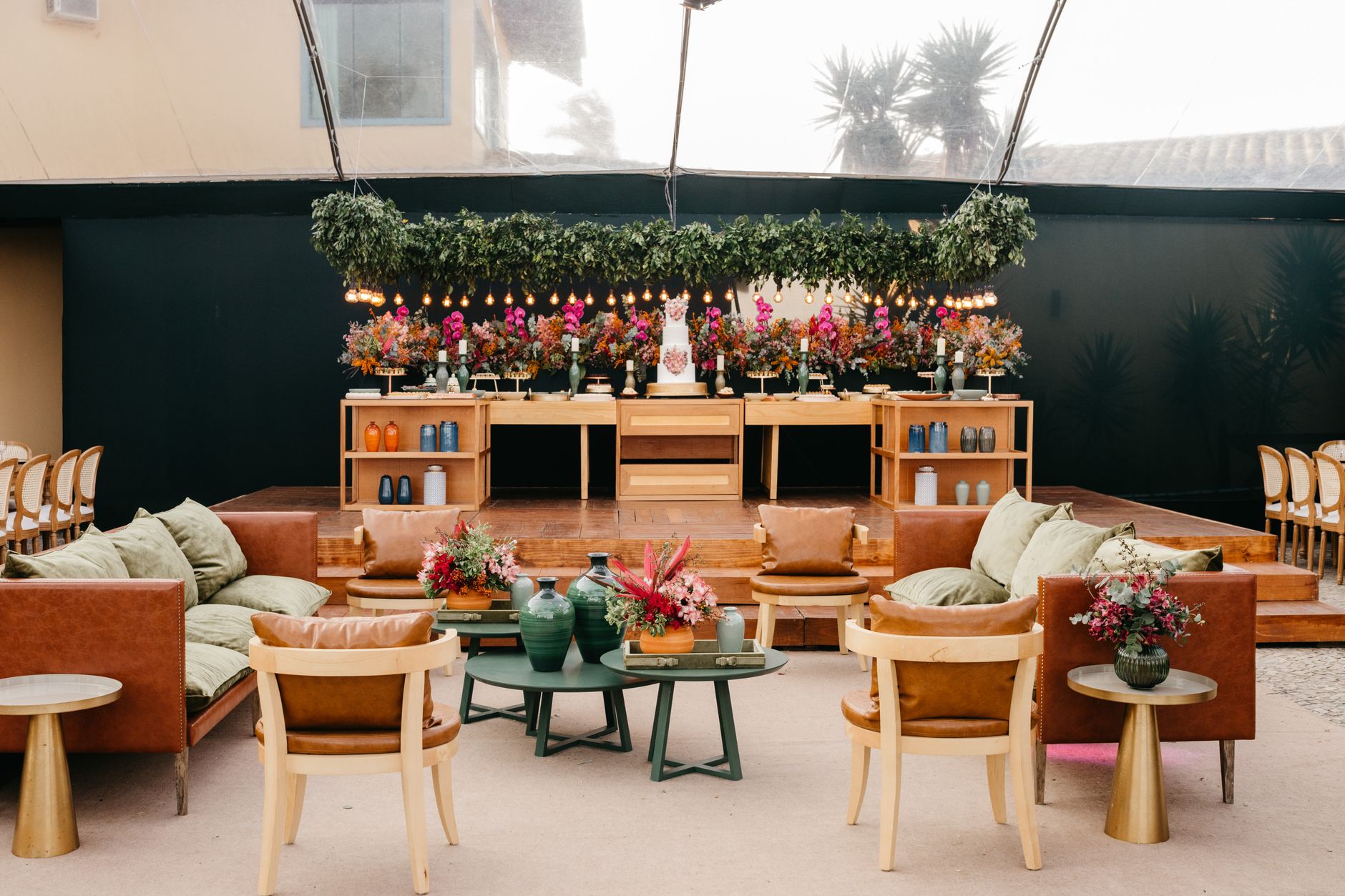 Luxurious indoor event setup featuring elegant seating and vibrant floral arrangements. — Upgrade Your Outdoor Space with Cus